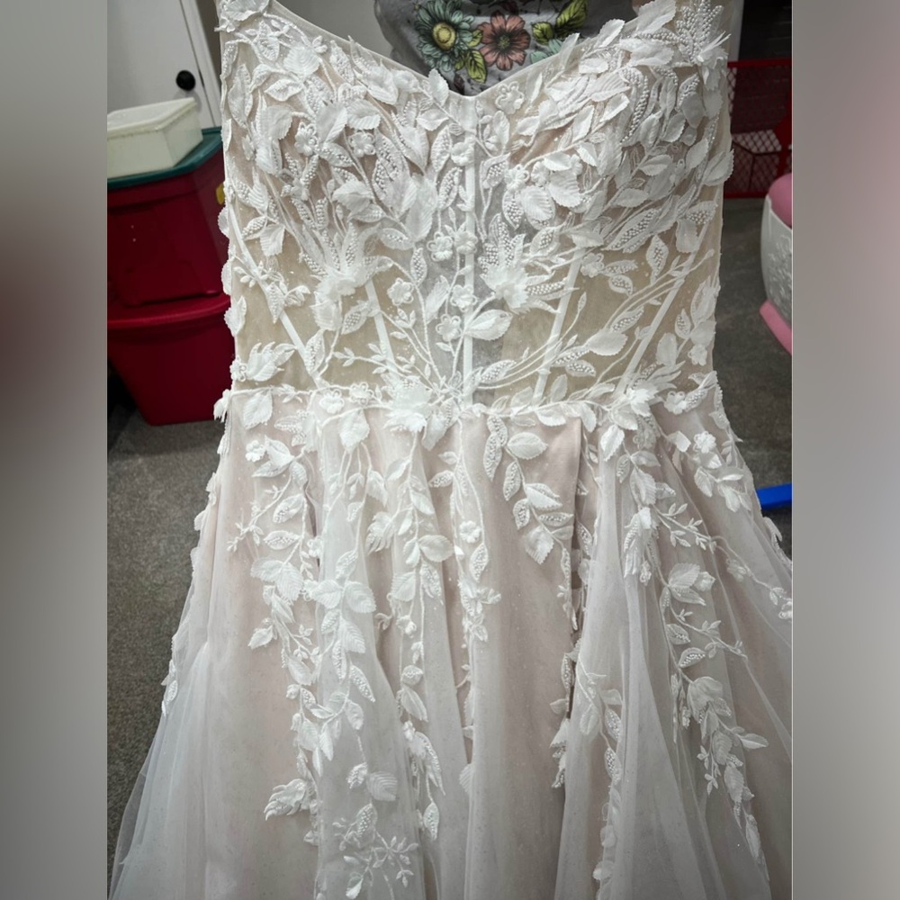 Size 22, bought two dresses, chose another dress. No alterations. New, no tag.